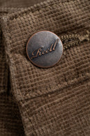 Reell Baggy Lichen Square Cord – baggy fit broek in groene corduroy met square ribstructuur en klassiek 5-pocket design