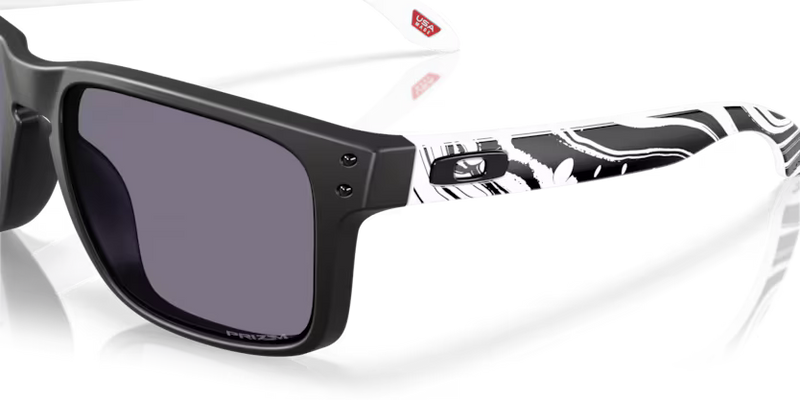 Koop de Oakley Holbrook Duality Collection Matte Black Prizm Black veilig en snel bij Revert 95 online of kom hem passen in de winkel in Haarlem.