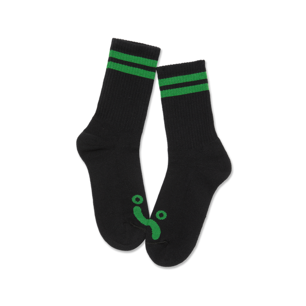 Polar Skate Co Rib Socks Happy Sad Black Green – ribgebreide sokken van katoenmix met Happy Sad-logo en zwarte kleur met groene details.